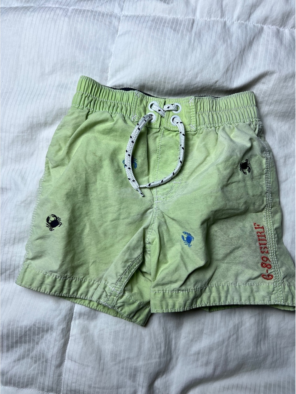 Baby Gap light green embroidered swim trunks size 18-24m